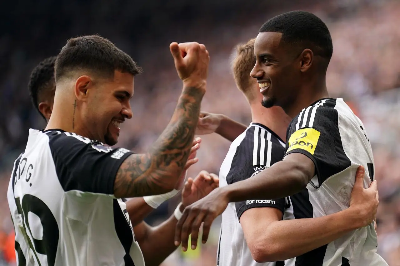 Newcastle's Alexander Isak (right) celebrates with team-mates after scoring against Ipswich