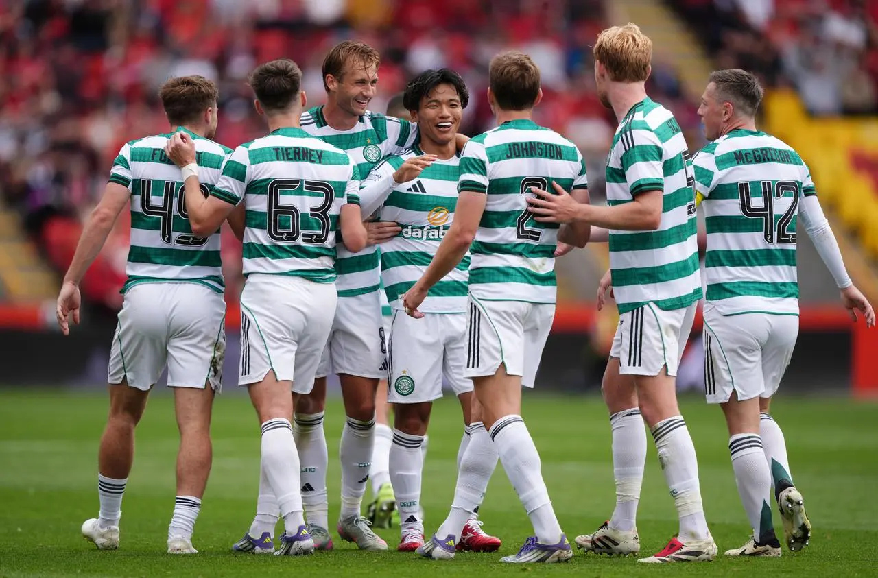 Reo Hatate, centre, celebrates his goal with team-mates including fellow scorer Benjamin Nygren, centre left