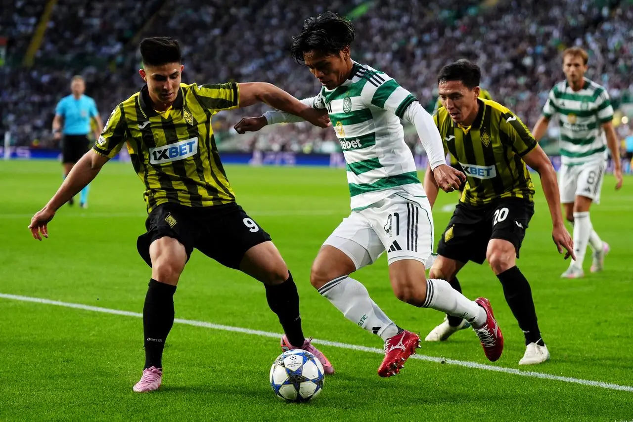 Reo Hatate battles for the ball