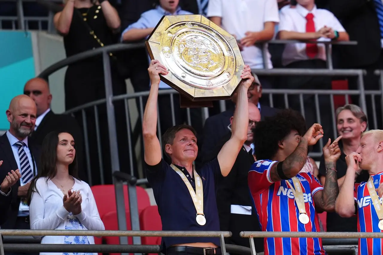 Oliver Glasner holds the Community Shield aloft