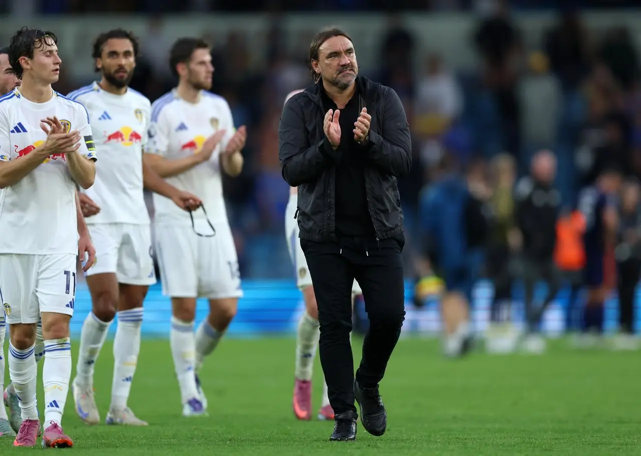 Leeds manager Daniel Farke applauds the fans