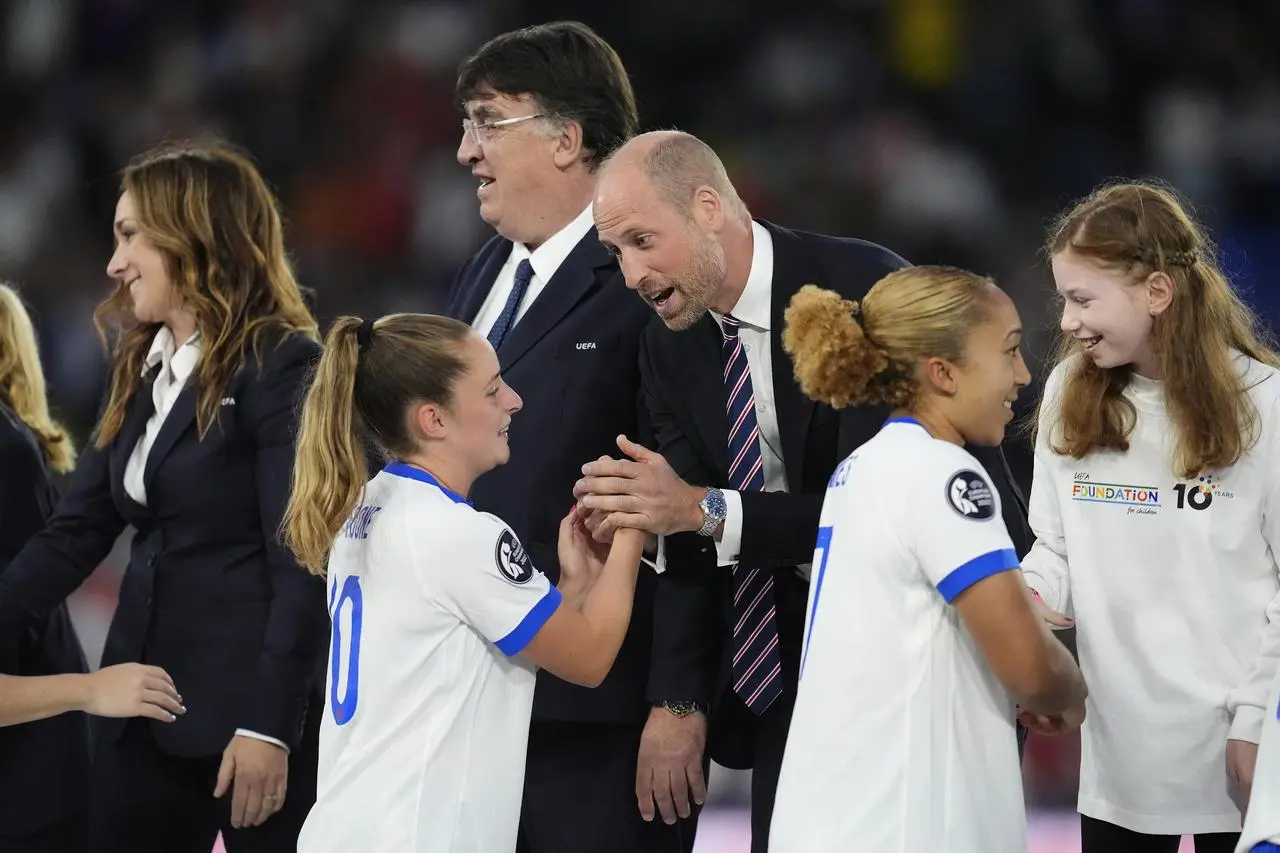 The Prince of Wales, centre right, speaks to England’s Ella Toone during the medal presentation after England won the Euro 2025 final in Basel