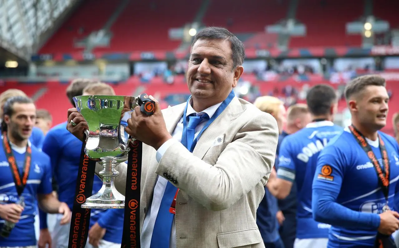 Hartlepool owner Raj Singh celebrates with the trophy after National League play-off final victory over Torquay