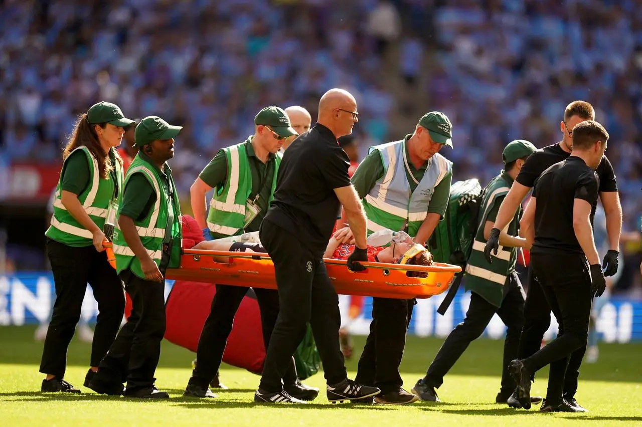 Luton’s Tom Lockyer leaves the pitch on a stretcher after collapsing during the Sky Bet Championship play-off final against Coventry at Wembley