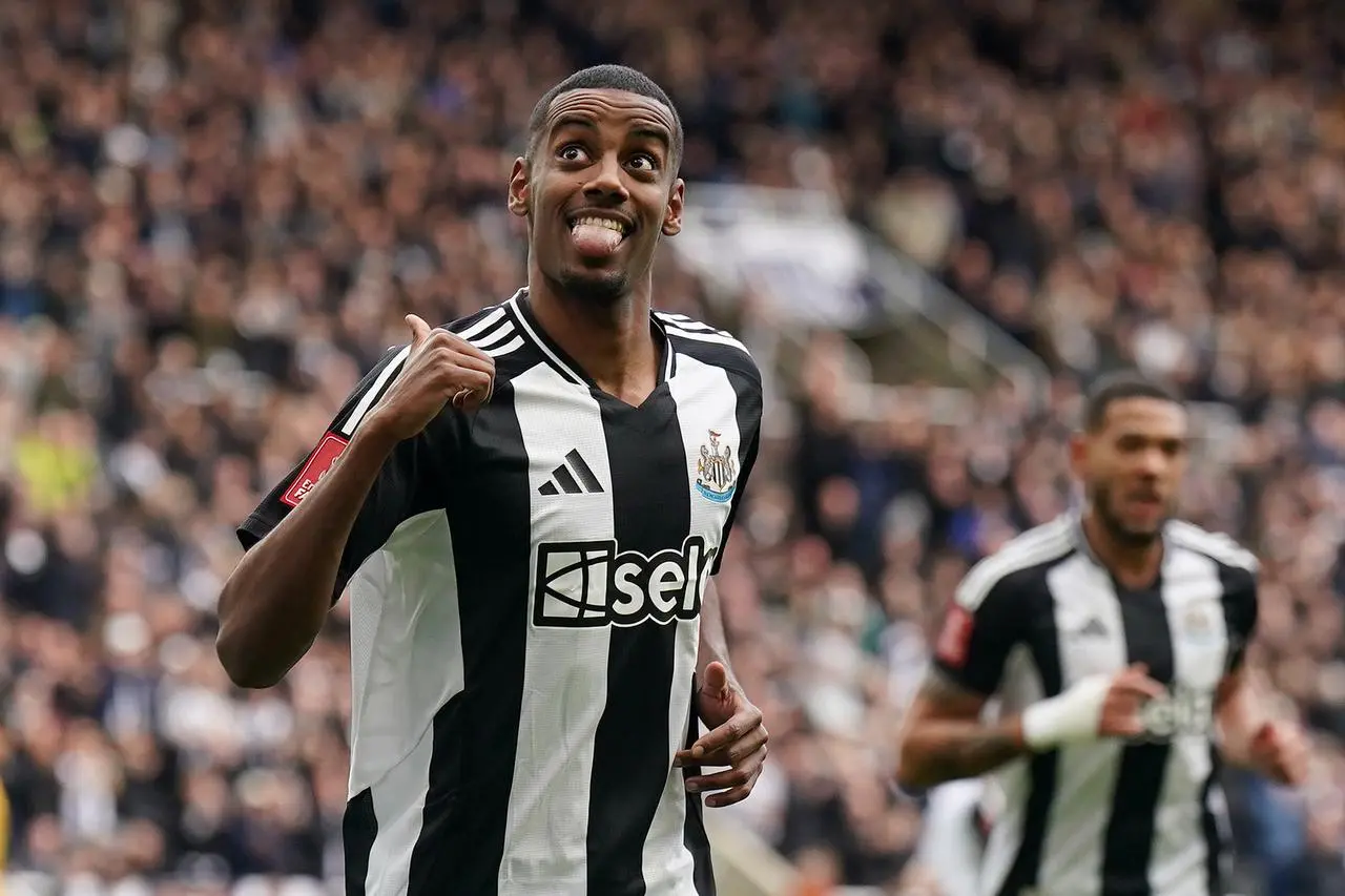 Alexander Isak pictured scoring a goal for Newcastle