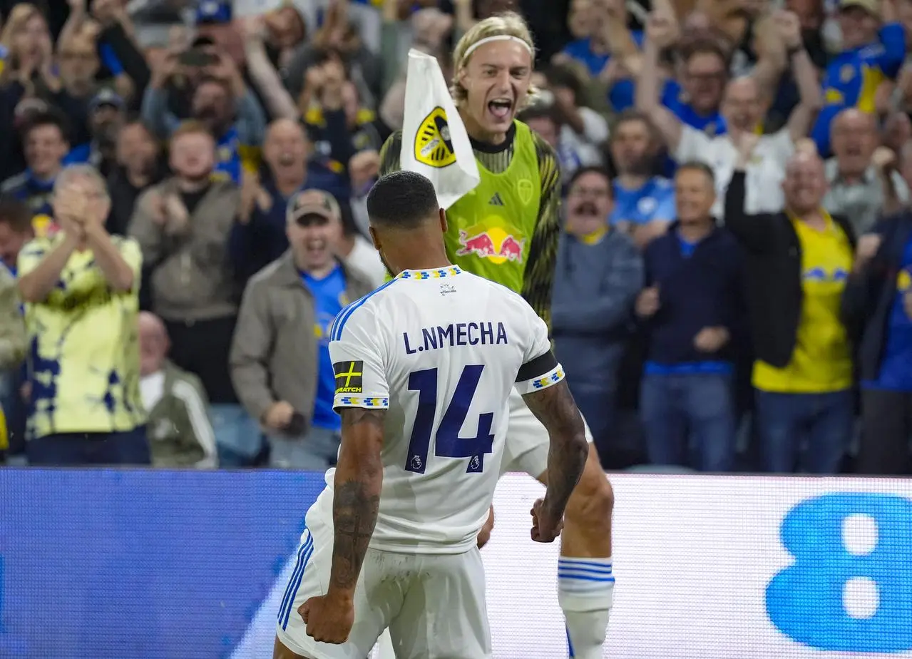 Lukas Nmecha celebrates after converting a penalty