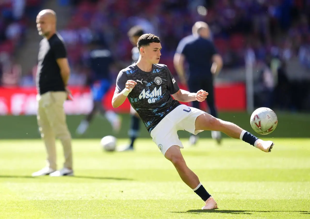 Manchester City's Phil Foden volleys the ball with his left foot