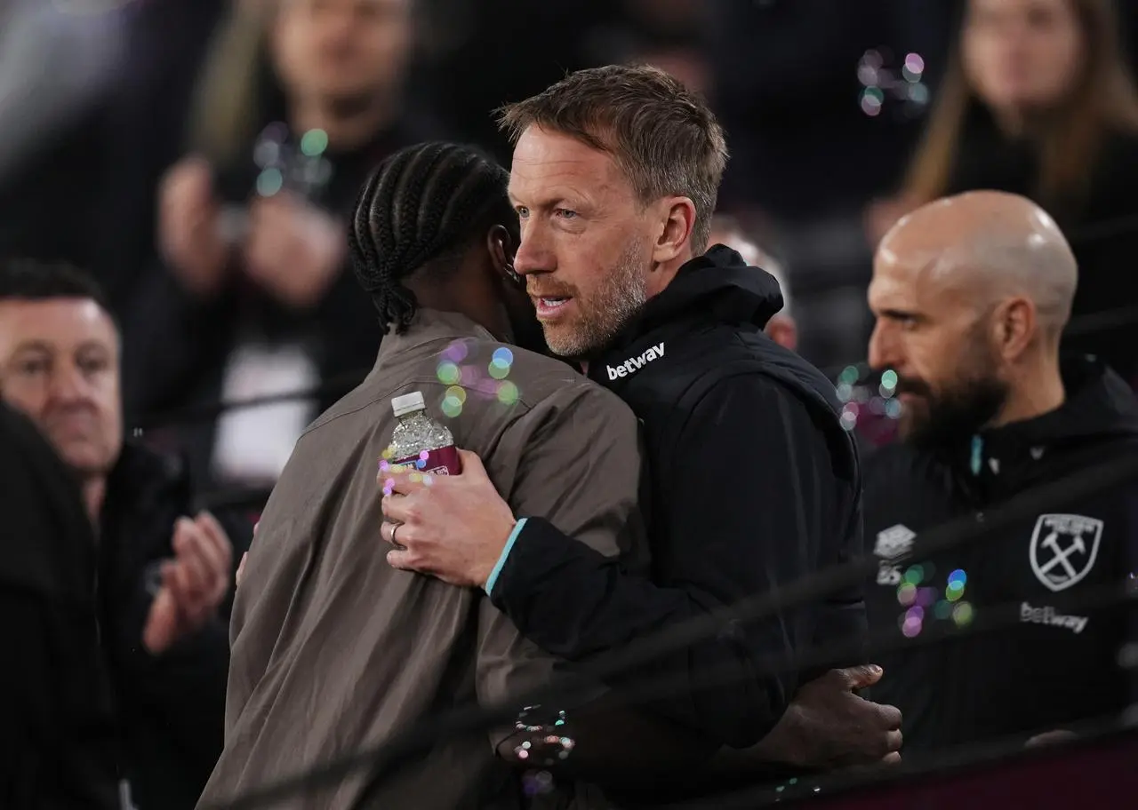 Michail Antonio and West Ham manager Graham Potter embrace