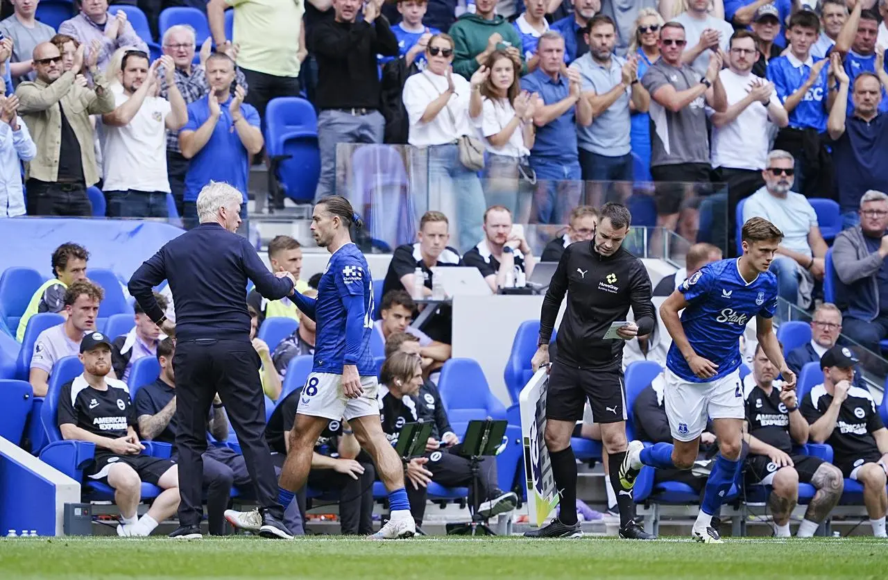 David Moyes greets Everton’s Jack Grealish on the sideline