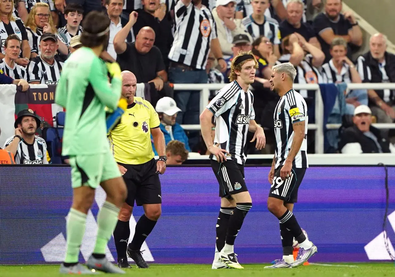 Anthony Gordon, second right, walks after being shown a red card