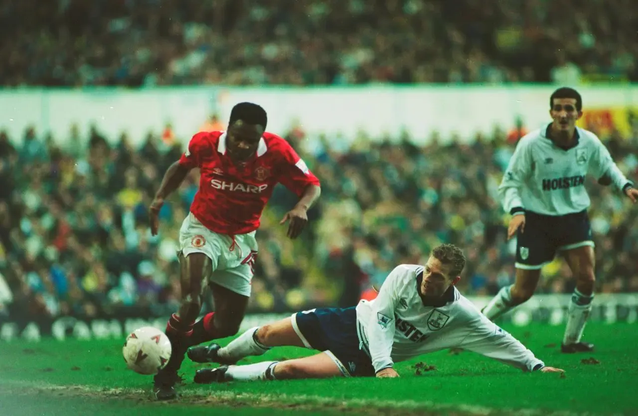 Manchester United defender Paul Parker (left) in action against Tottenham