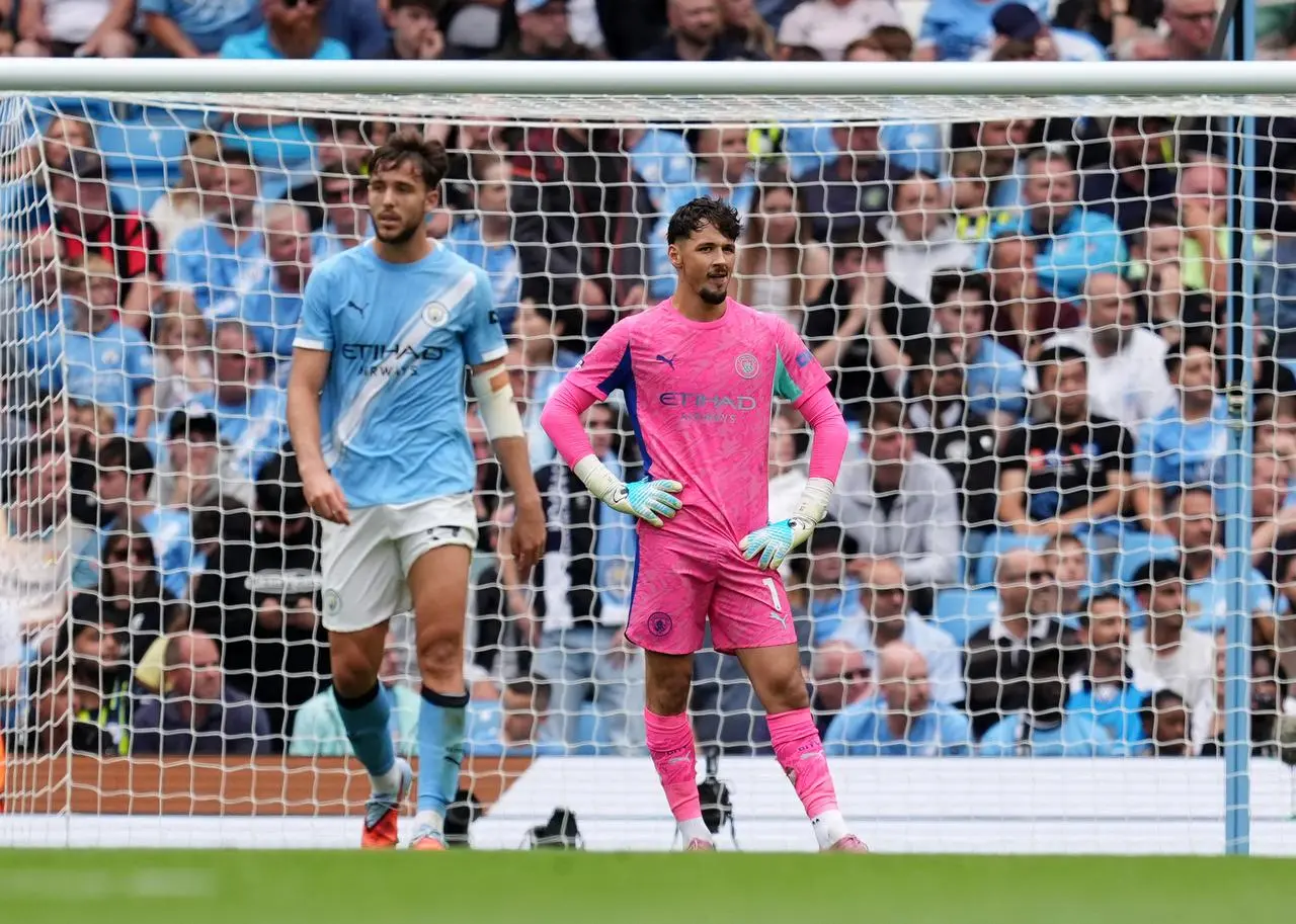 Manchester City goalkeeper James Trafford looks dejected after conceding against Tottenham