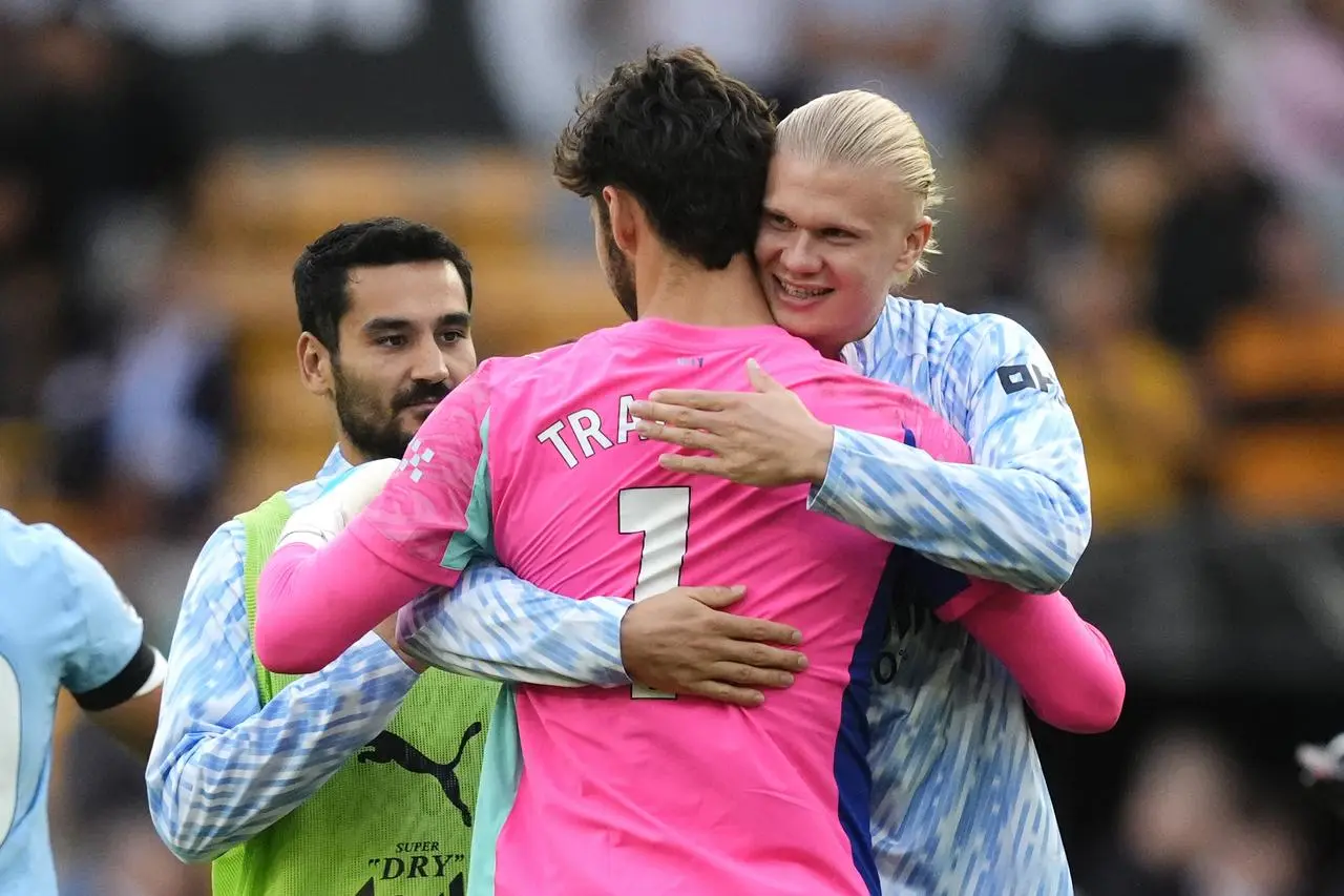 James Trafford is hugged by Erling Haaland