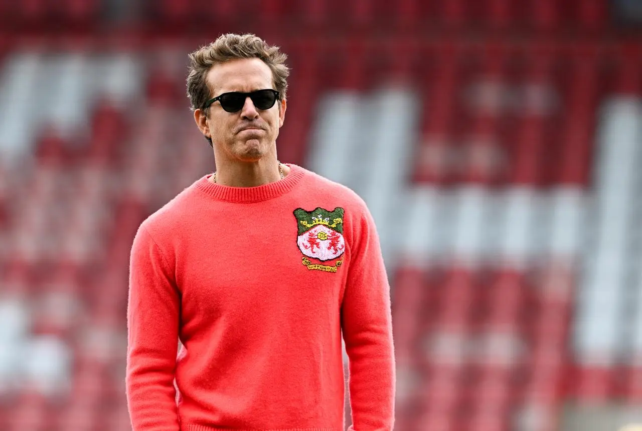 Ryan Reynolds in a red Wrexham jumper