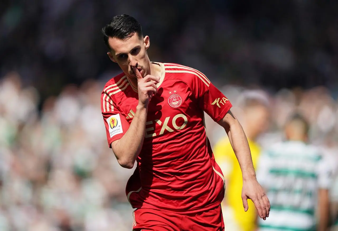 Bojan Miovski puts his finger to his lips after scoring for Aberdeen against Celtic