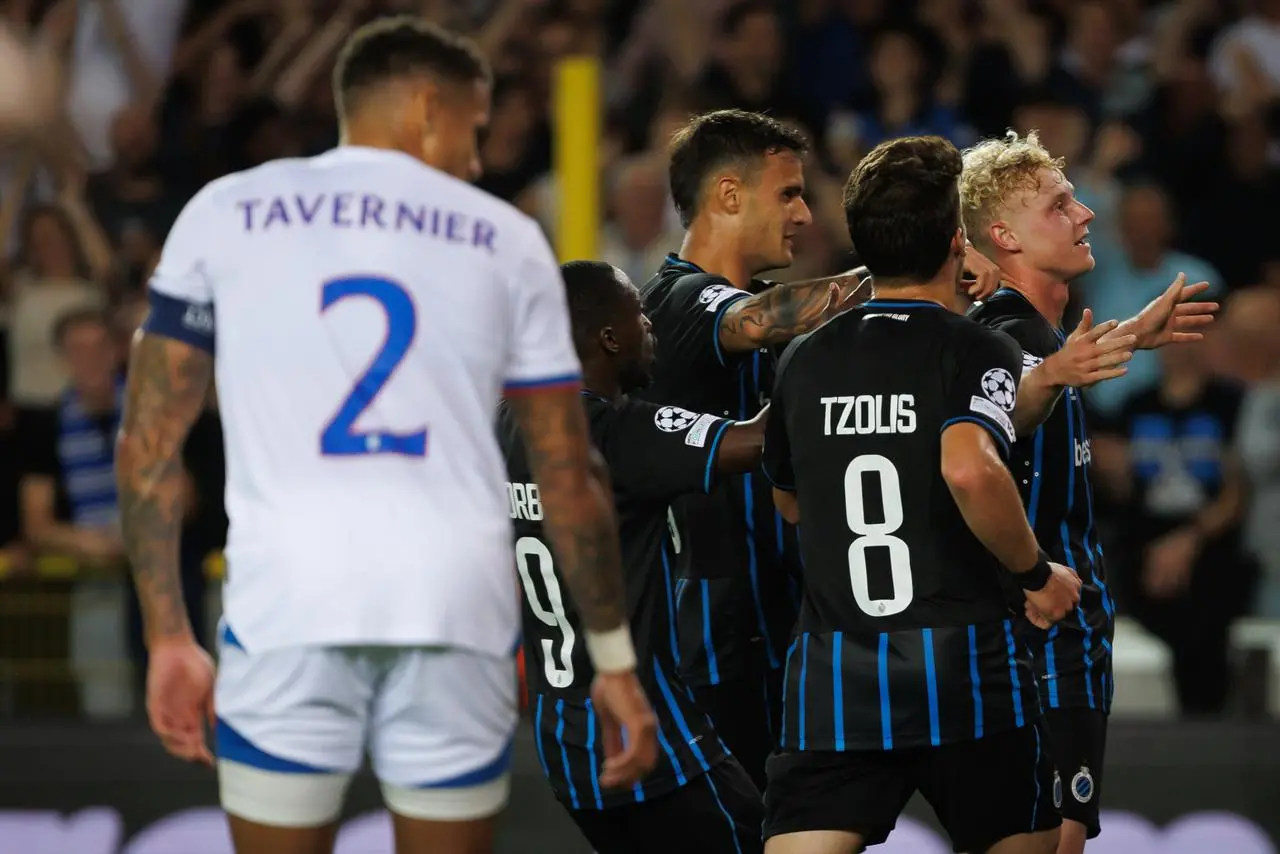 James Tavernier watches on as Club Brugge players celebrate