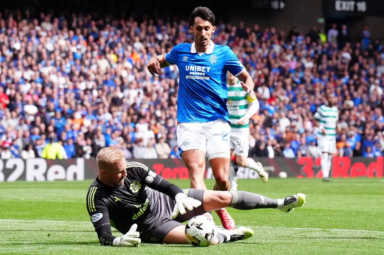 Kasper Schmeichel claims the ball from Rangers’ Bojan Miovski 