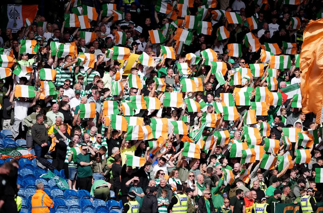 Celtic fans hold up Irish flags