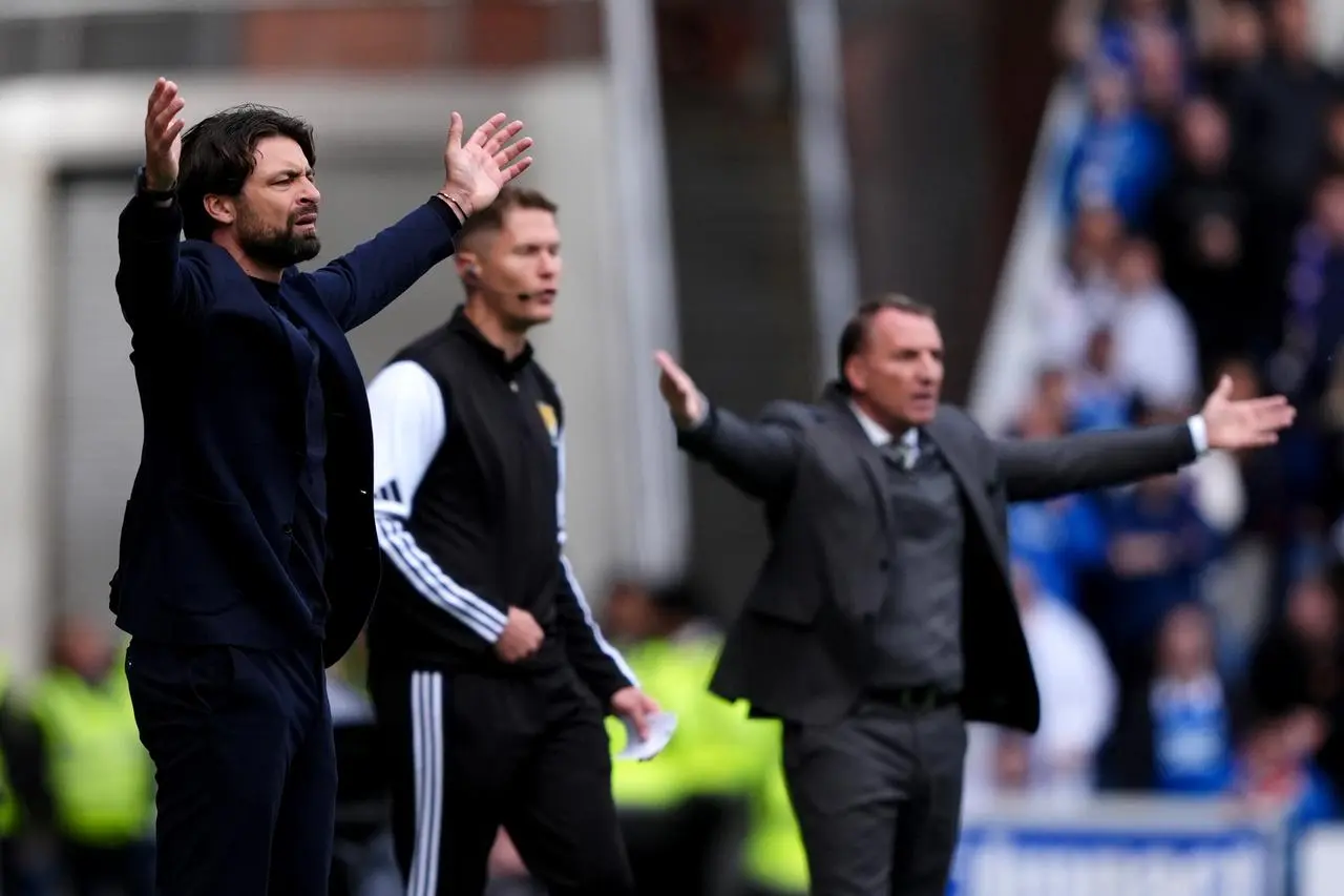 Russell Martin and Brendan Rodgers both raise their arms into the air