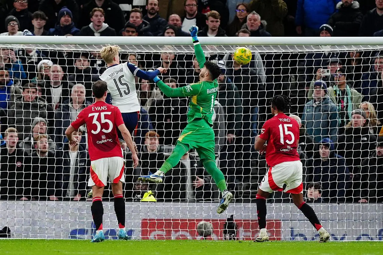 Manchester United goalkeeper Altay Bayindir (centre) fails to prevent Tottenham’s Son Heung-Min from scoring last season