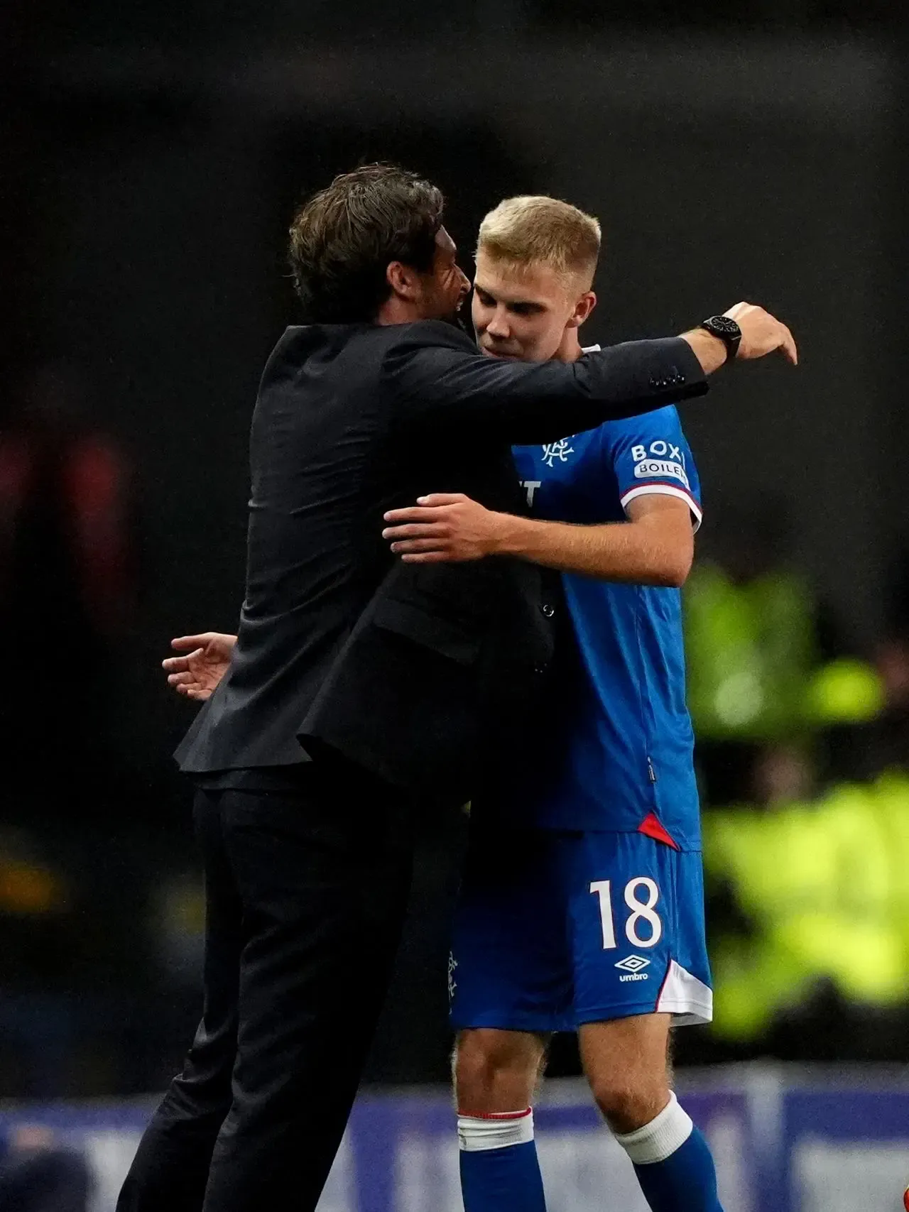 Rangers manager Russell Martin embraces Oliver Antman as he comes off after being substituted against Viktoria Plzen