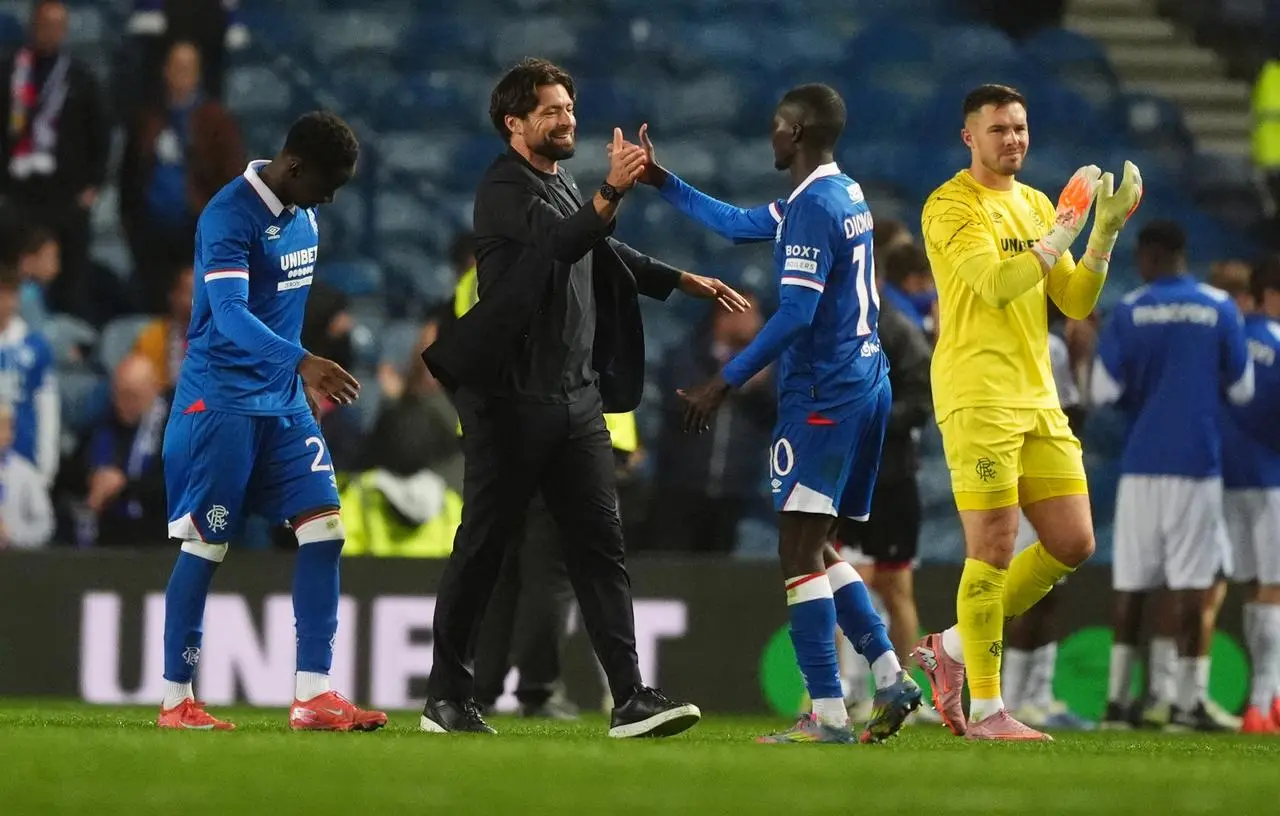 Rangers manager Russell Martin, centre, and Mohammed Diomande celebrate victory over Viktoria Plzen