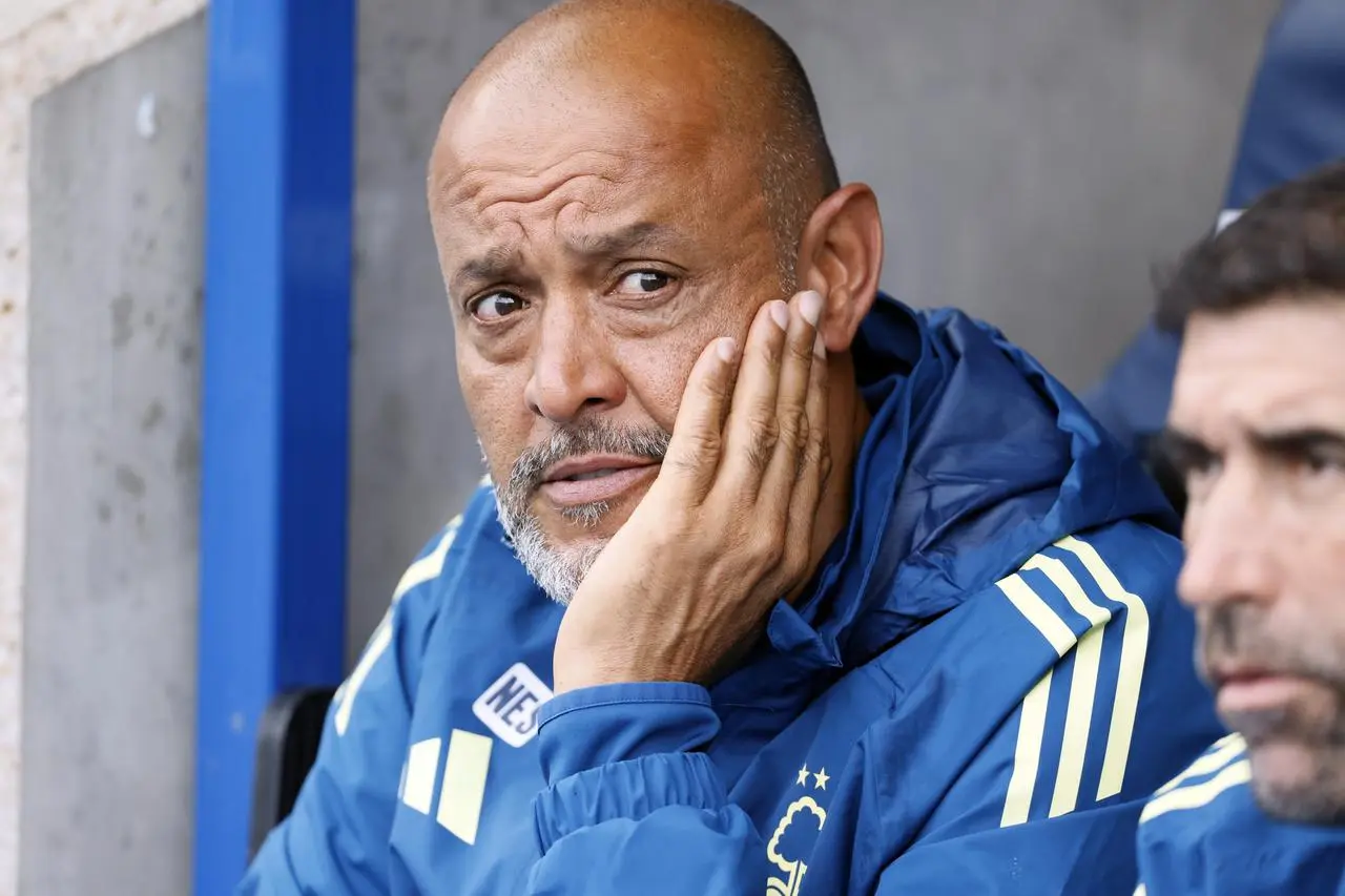 Nottingham Forest manager Nuno Espirito Santo holds his head in his hand.