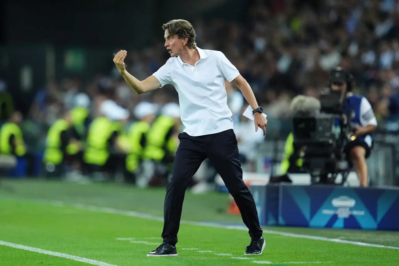 Tottenham manager Thomas Frank gestures on the touchline.