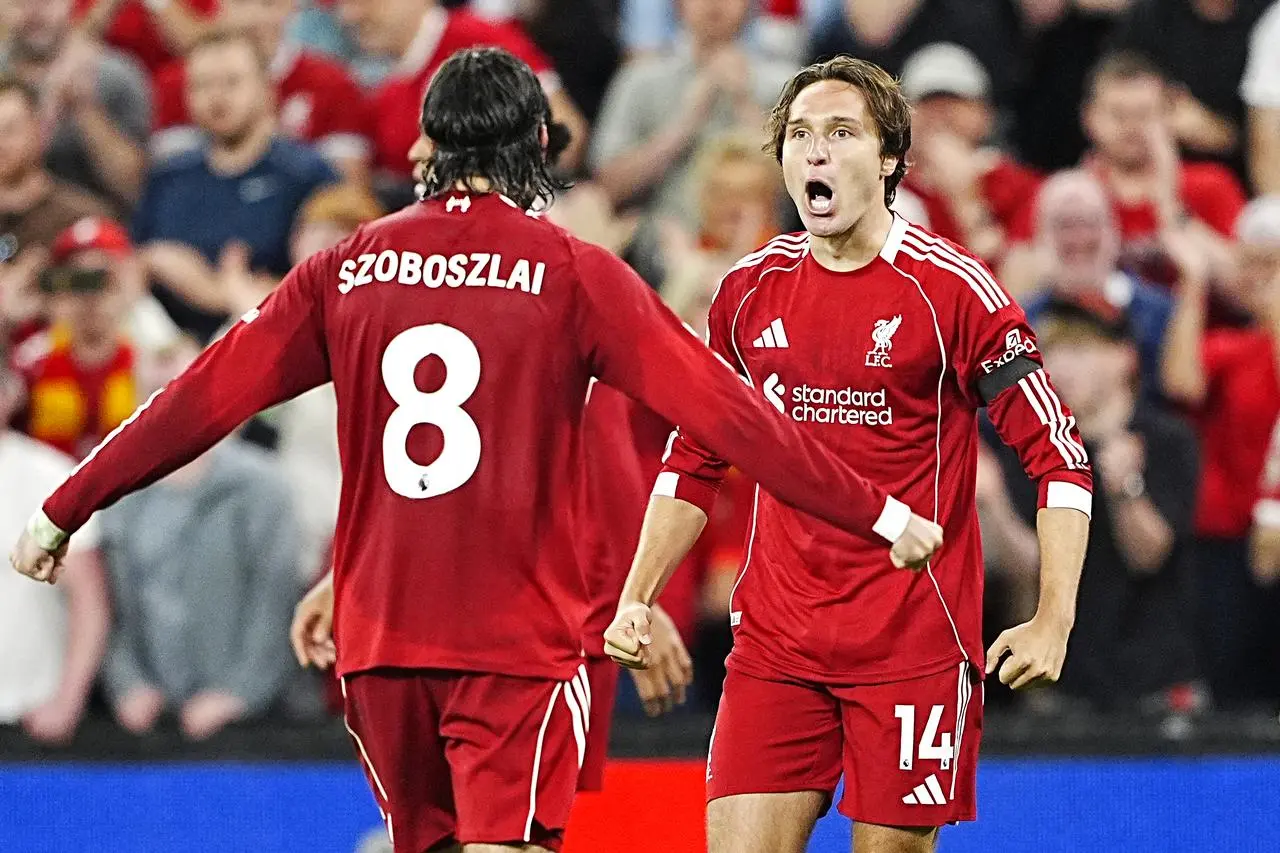 Liverpool’s Federico Chiesa (right) celebrates scoring their side’s third goal of the game with team-mate Dominik Szoboszlai during the Premier League match at Anfield