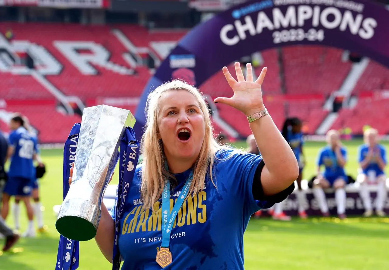 Former Chelsea manager Emma Hayes celebrates with the WSL trophy