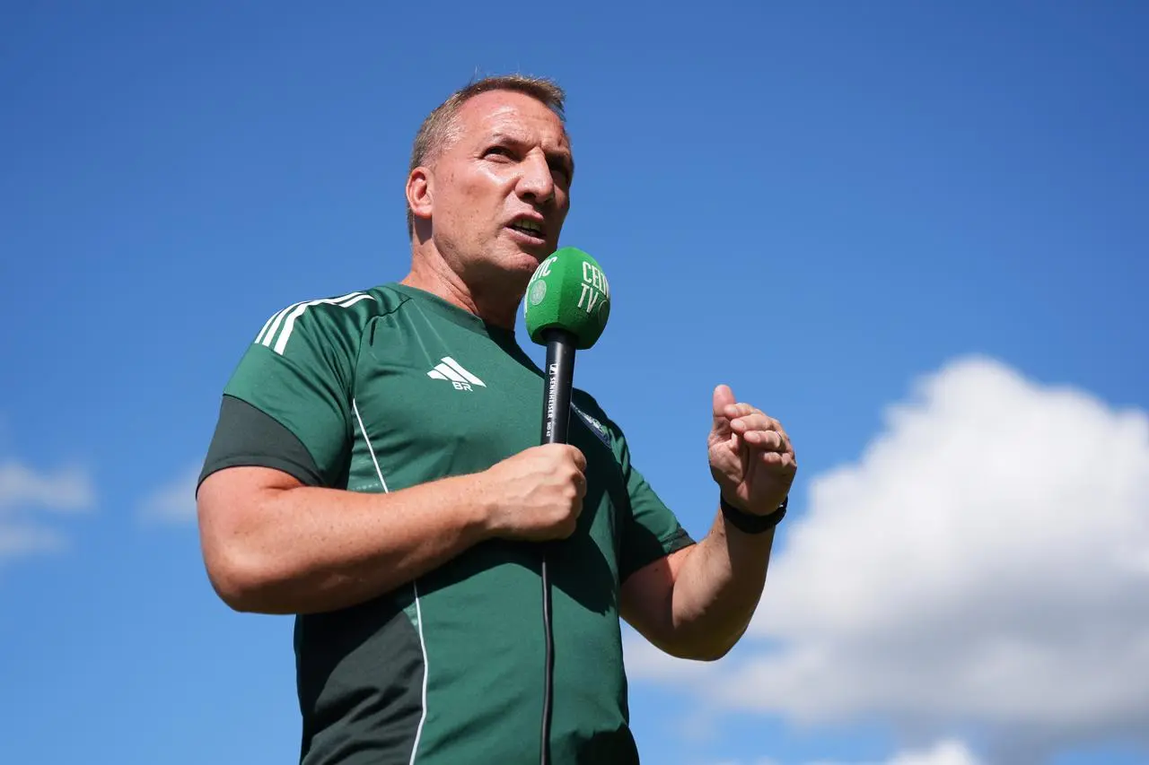 Brendan Rodgers speaks into a microphone