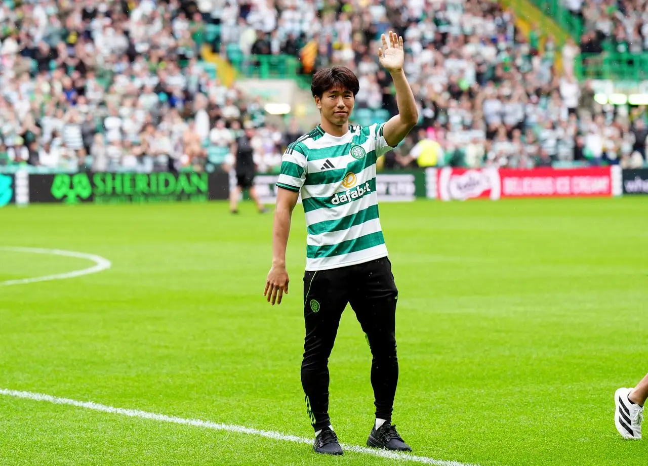 Shin Yamada waves to fans at Celtic Park
