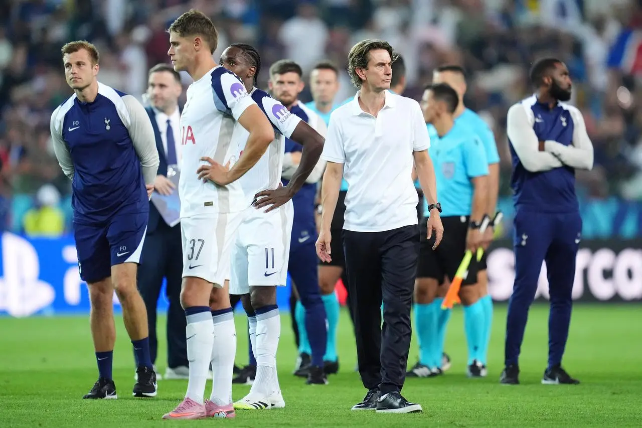 New Tottenham manager Thomas Frank, centre right, reacts after losing the UEFA Super Cup final on penalties