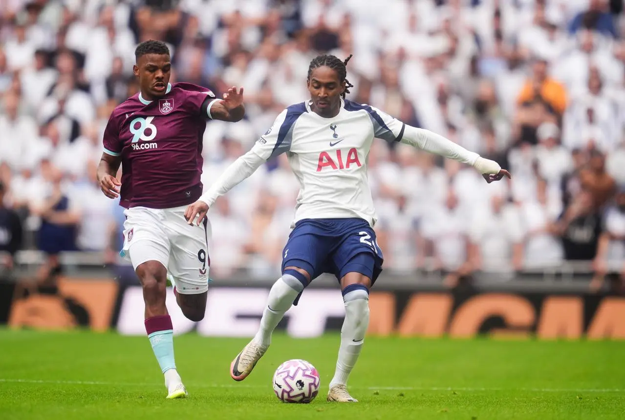 Djed Spence, right, and Lyle Foster battle for the ball