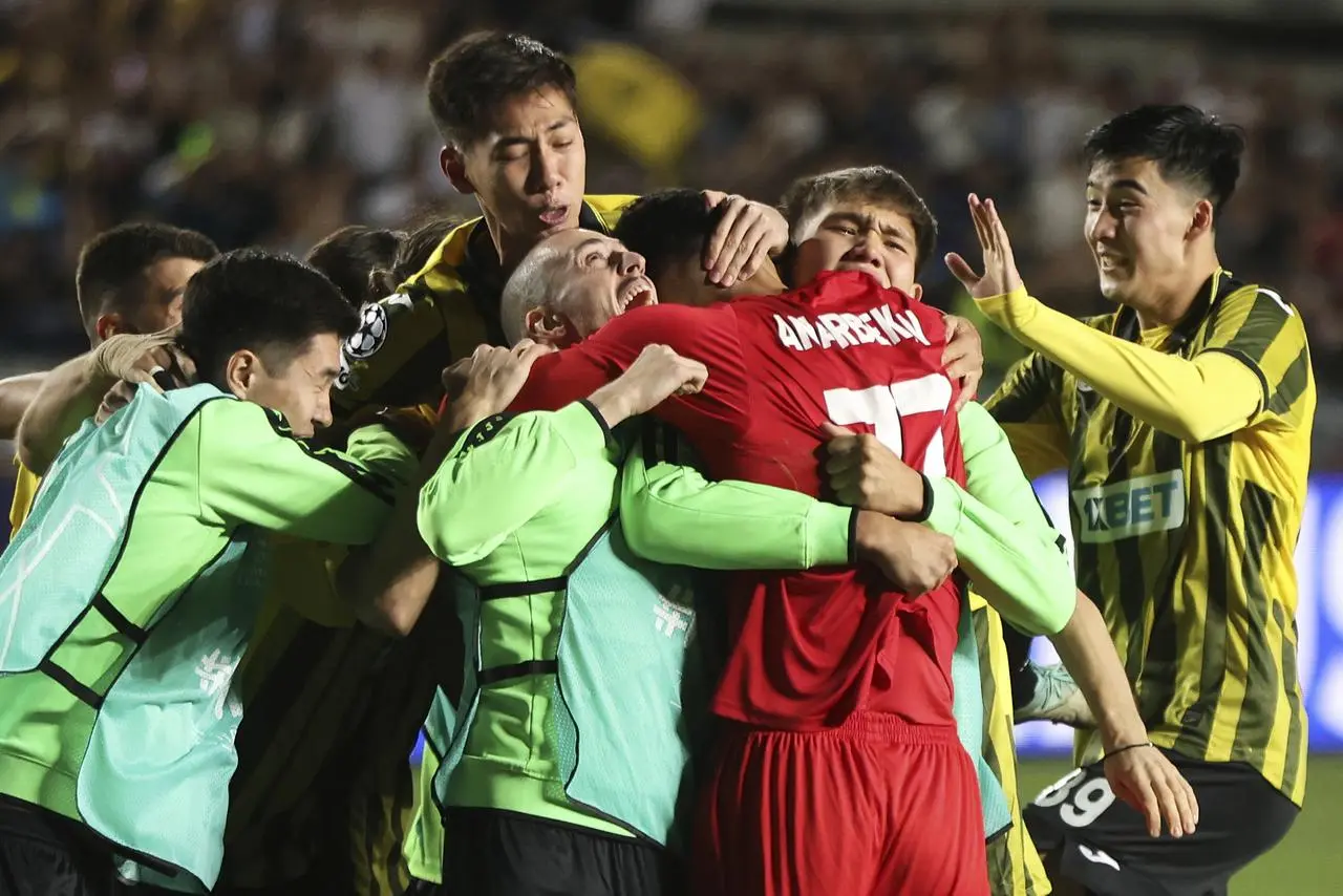 Kairat players celebrate their play-off victory against Celtic 