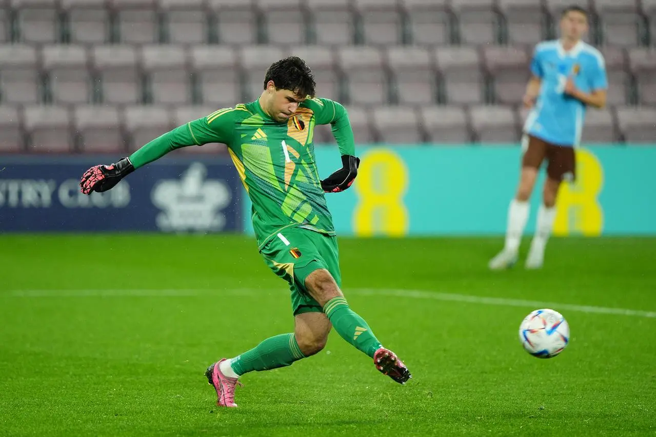 Senne Lammens plays a pass during a Belgium Under-21 fixture