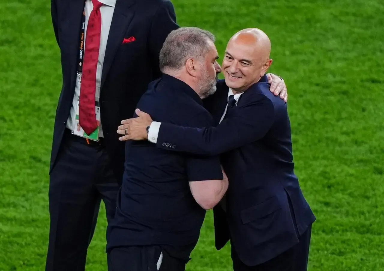 Ange Postecoglou and Daniel Levy embrace after winning the Europa League