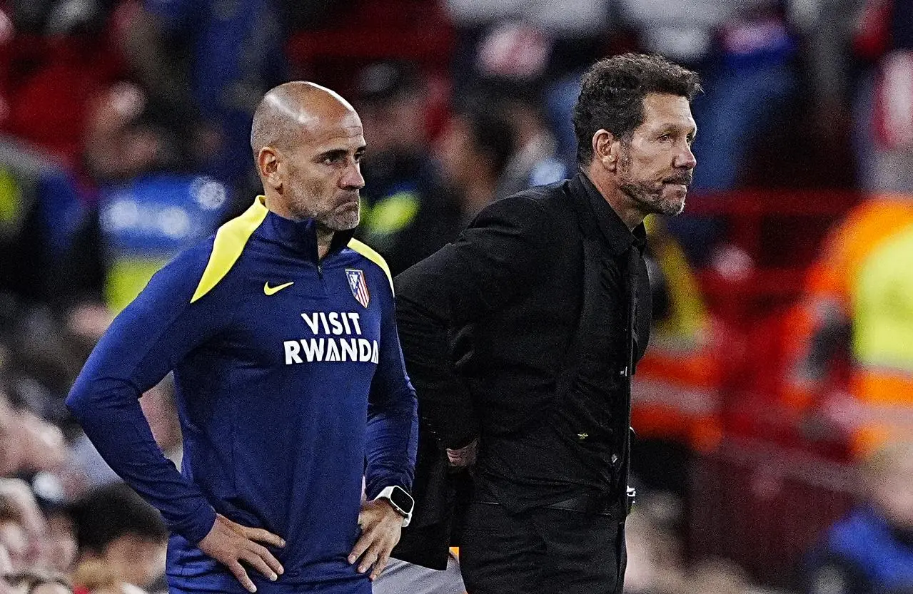 Atletico Madrid manager Diego Simeone, right, on the touchline