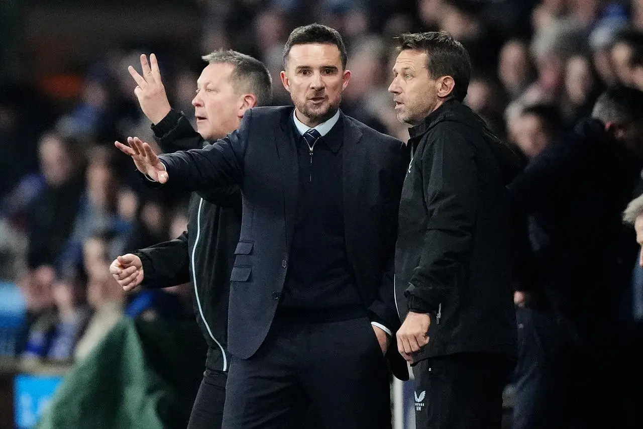 Then Rangers interim head coach Barry Ferguson (centre), Billy Dodds and Neil McCann (right) talk on the touchline