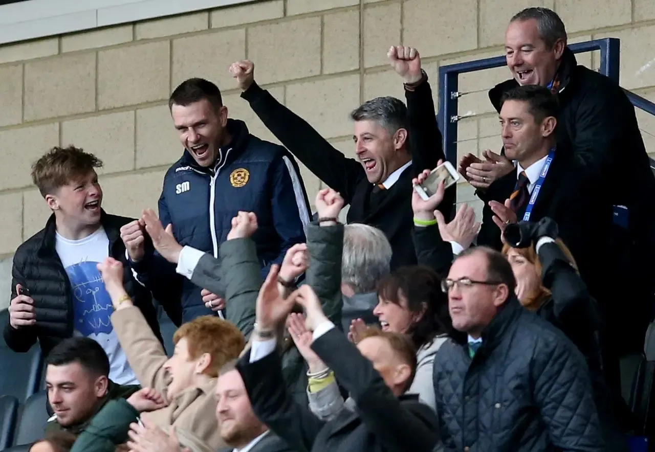 Stephen Robinson, arms raised, celebrates Motherwell's semi-final win over Rangers in 2017