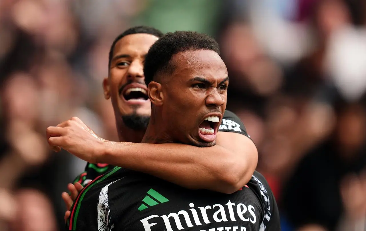 Arsenal’s Gabriel celebrates a goal with team-mate William Saliba, back