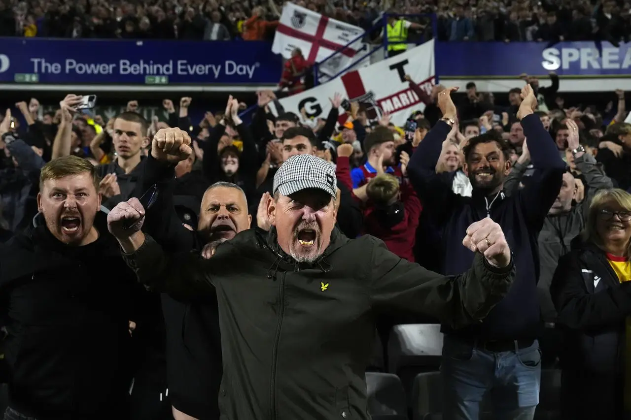 Grimsby fans celebrate victory at Sheffield Wednesday