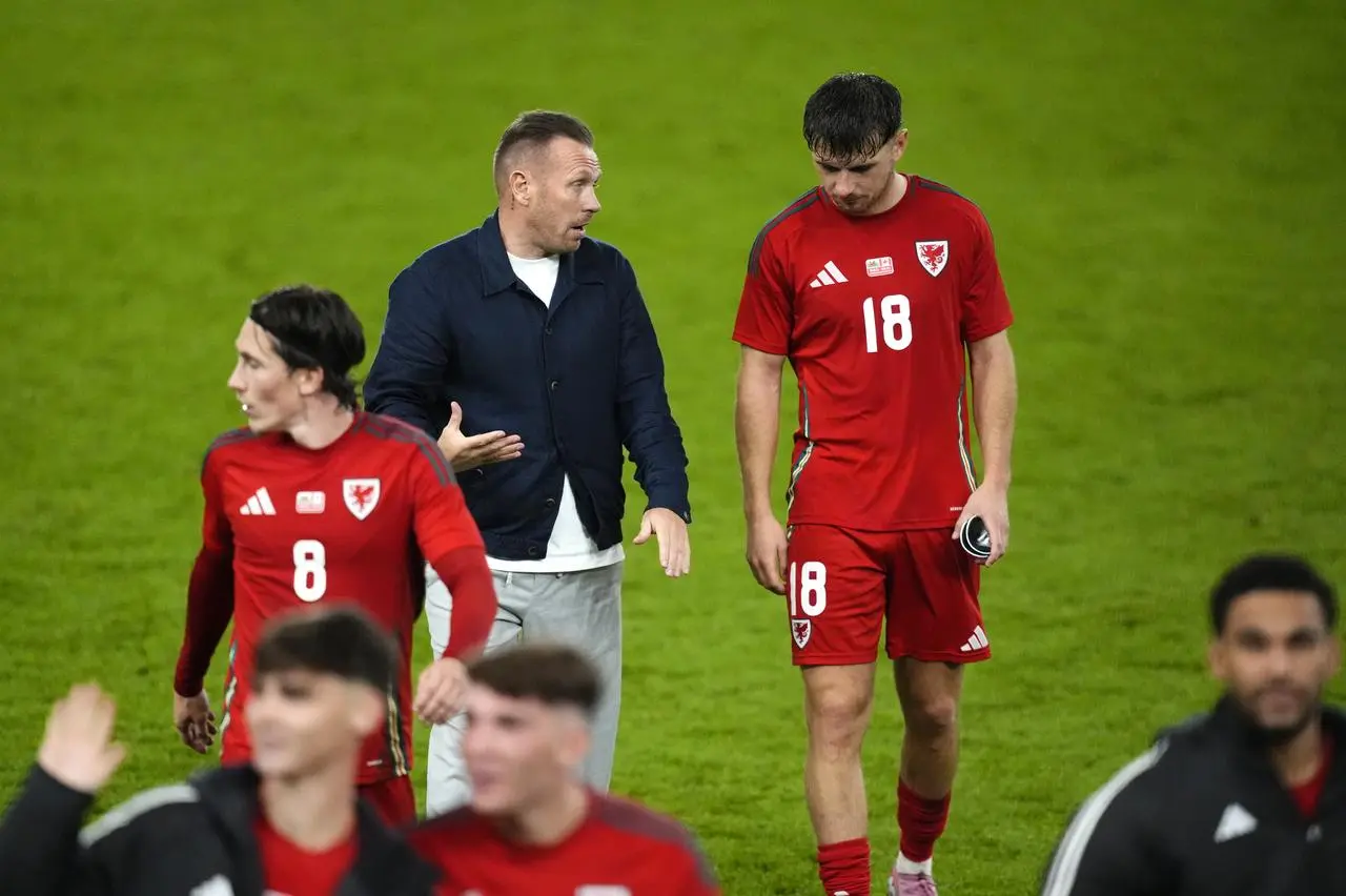 Wales manager Craig Bellamy talks to striker Mark Harris, right, after their friendly defeat to Canada