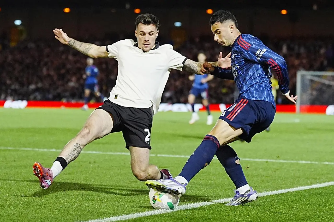 Arsenal’s Gabriel Martinelli and Port Vale’s Mitchell Clark battle for the ball 