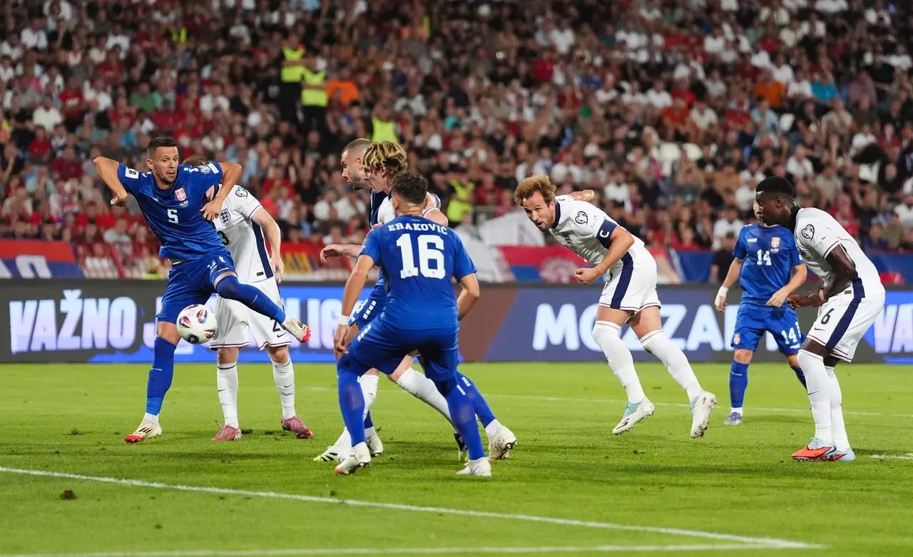 Harry Kane, third right, heads England in front against Serbia