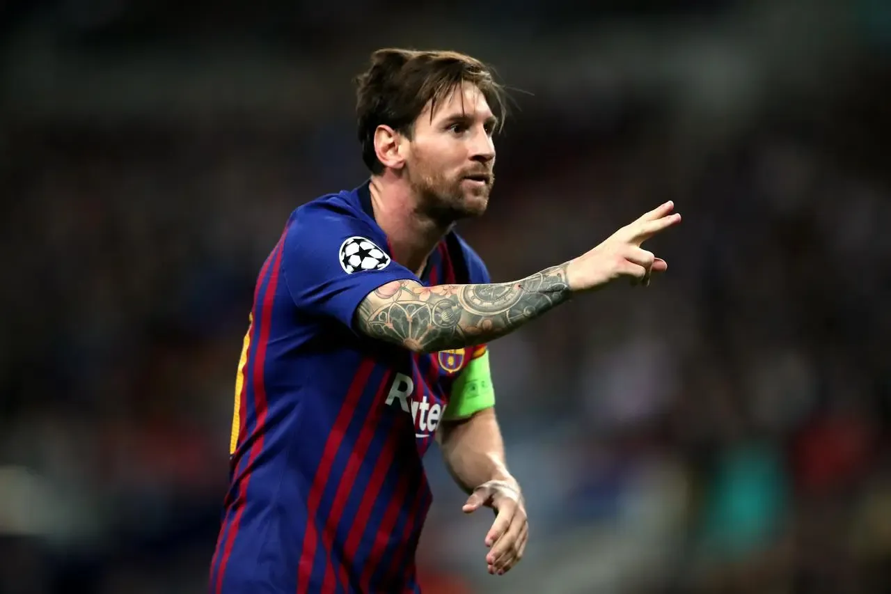 Lionel Messi celebrates scoring for Barcelona against Tottenham in 2018