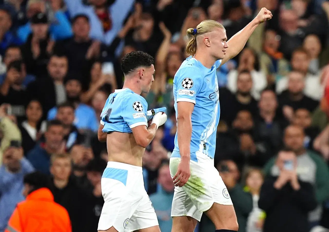 Manchester City’s Erling Haaland (right) celebrates scoring in the Champions League against Napoli