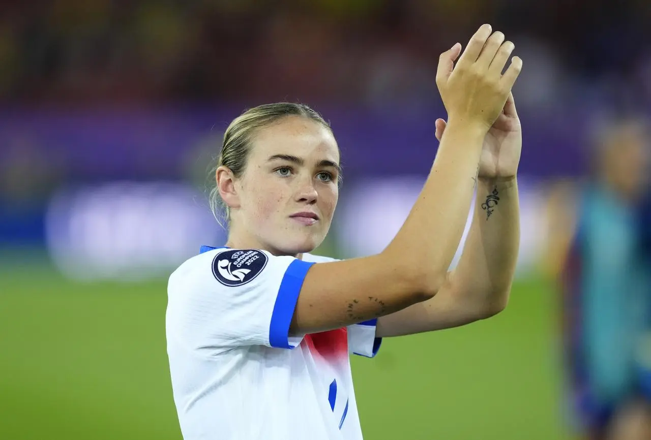 Grace Clinton applauding