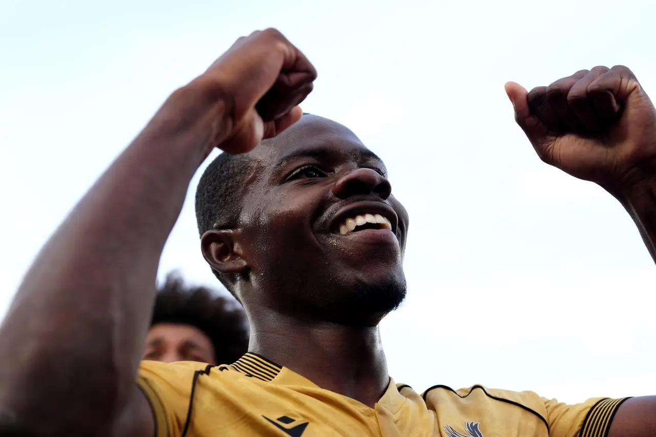 Tyrick Mitchell celebrates