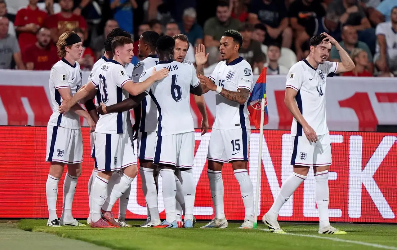 England’s Harry Kane celebrates scoring the opening goal with team-mates
